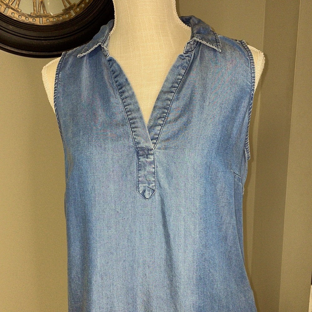 Medium sleeveless denim/chambray dress with pockets. A little longer in the back
